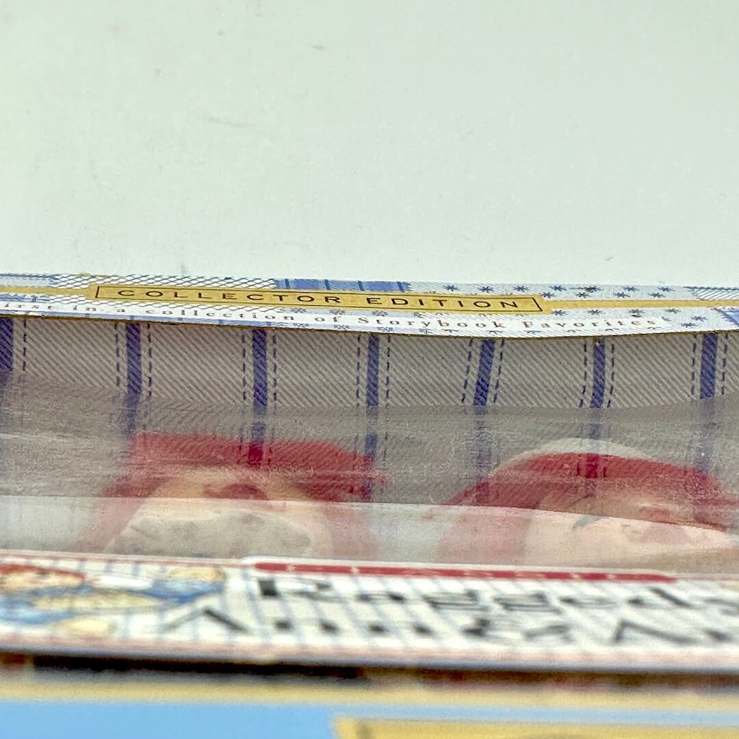 View of plastic window bowed in from cardboard box.