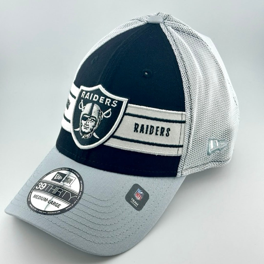 Baseball cap with white plastic mesh back, grey brim & black face with Raiders logo in center. New Era logo on left side.