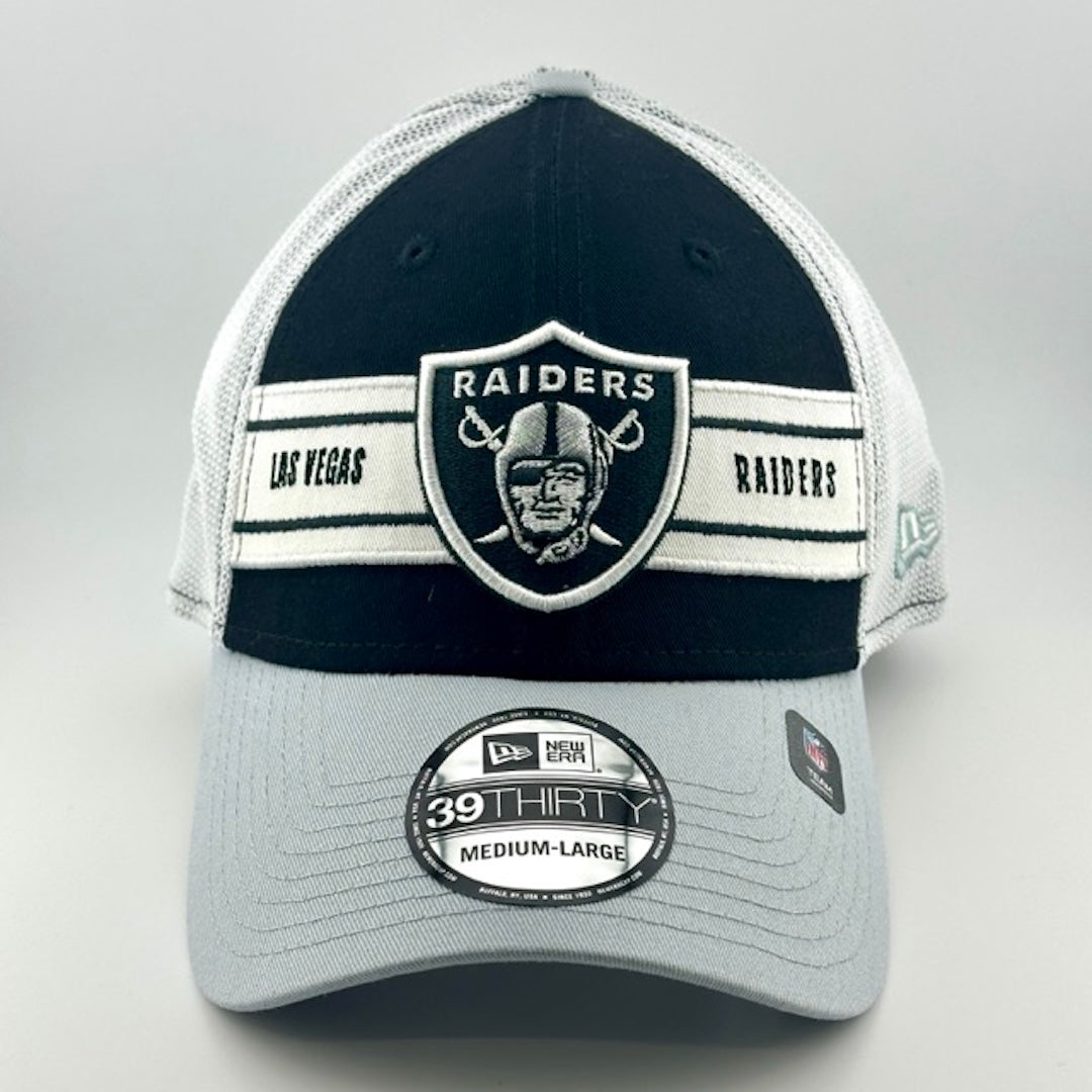 Baseball cap with white plastic mesh back, grey brim & black face with Raiders logo in center. New Era logo on left side.