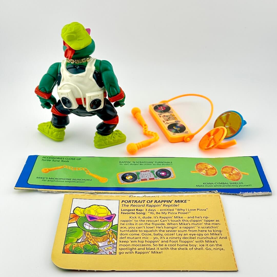 Toy figure with accessories and character information card on a white background