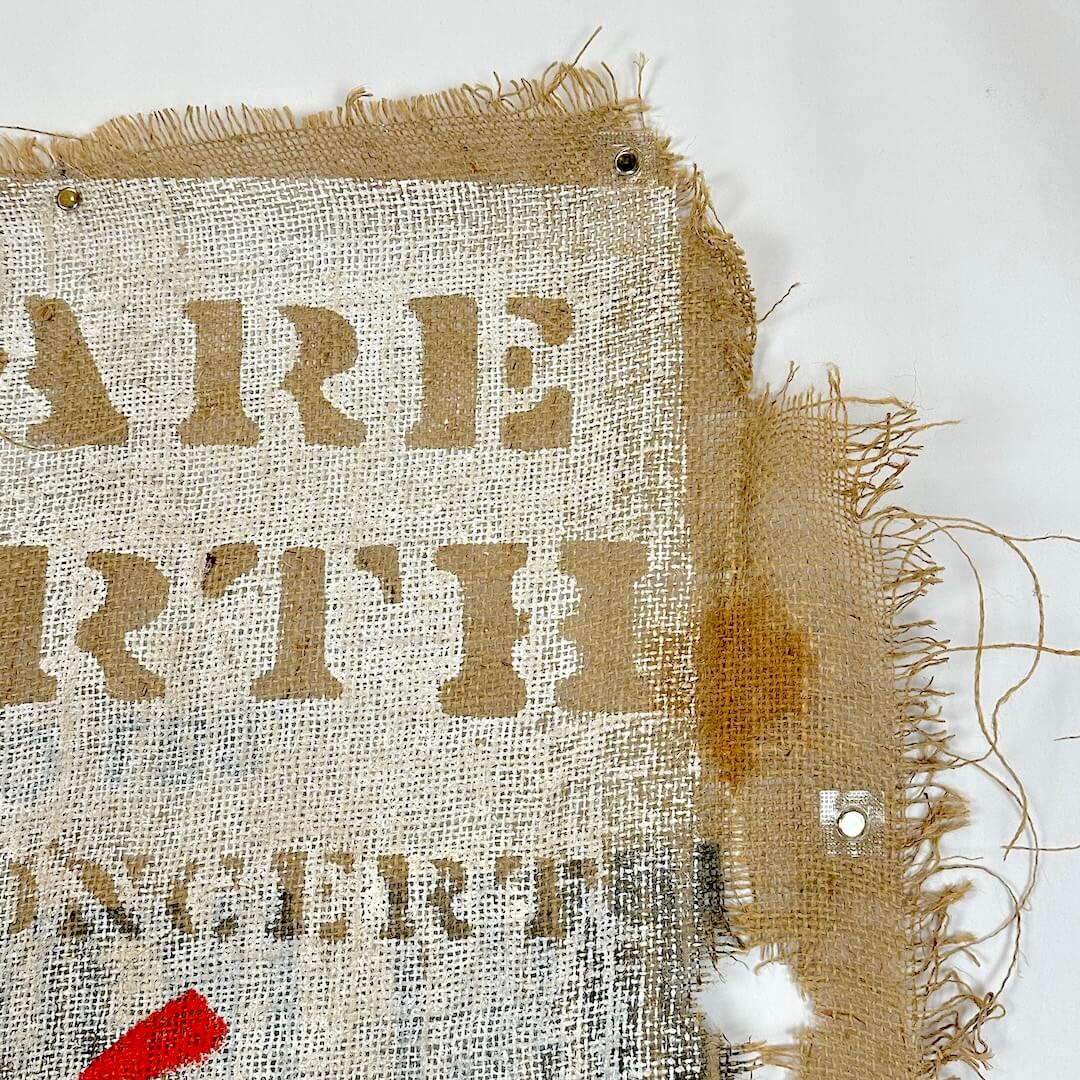 Textured fabric with partially visible words on a white background