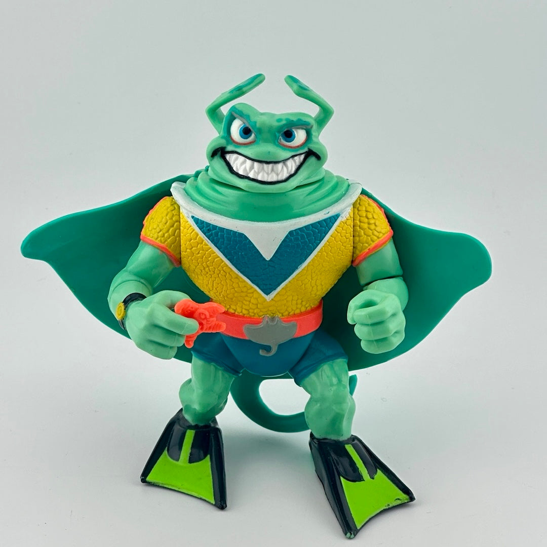Anthropomorphized stingray wearing yellow shirt, orange belt, blue shorts, green scuba flippers, holding orange starfish. Front.