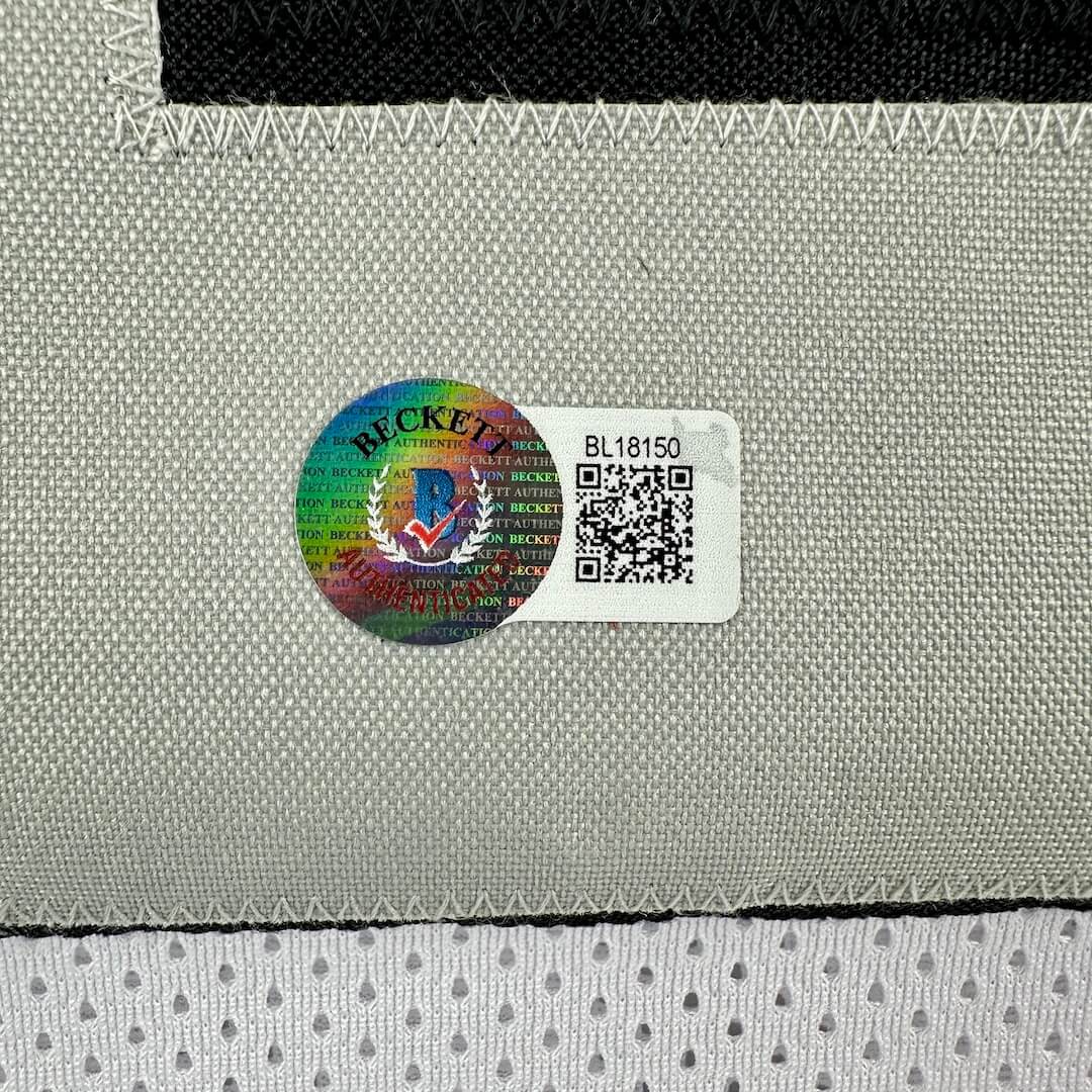 Authentication sticker label with a QR code on a textured surface