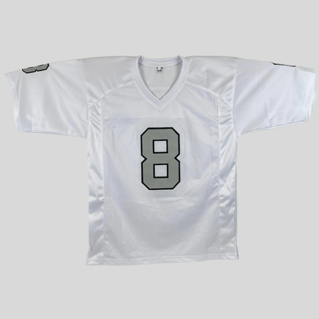 White sports jersey with silver number 8 with black outline on a gray background