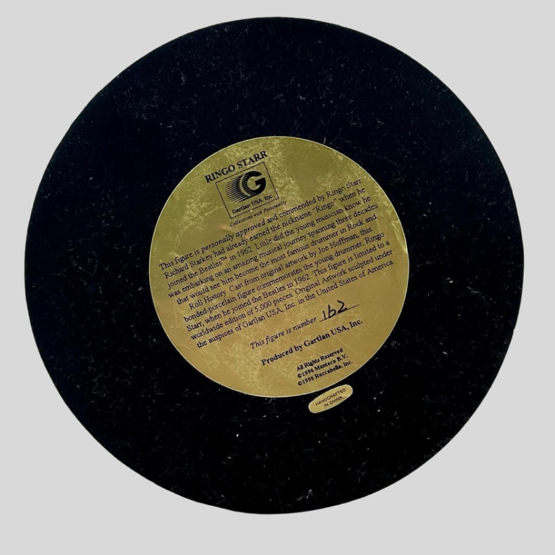 Bottom of base to show black background and gold sticker with product and manufacturer info.