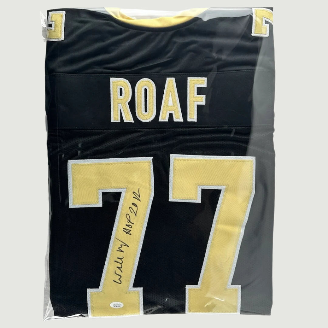 Black Saints football jersey with sewn gold/white numbers & nameplate, "Roaf" #77, signed with black marker.