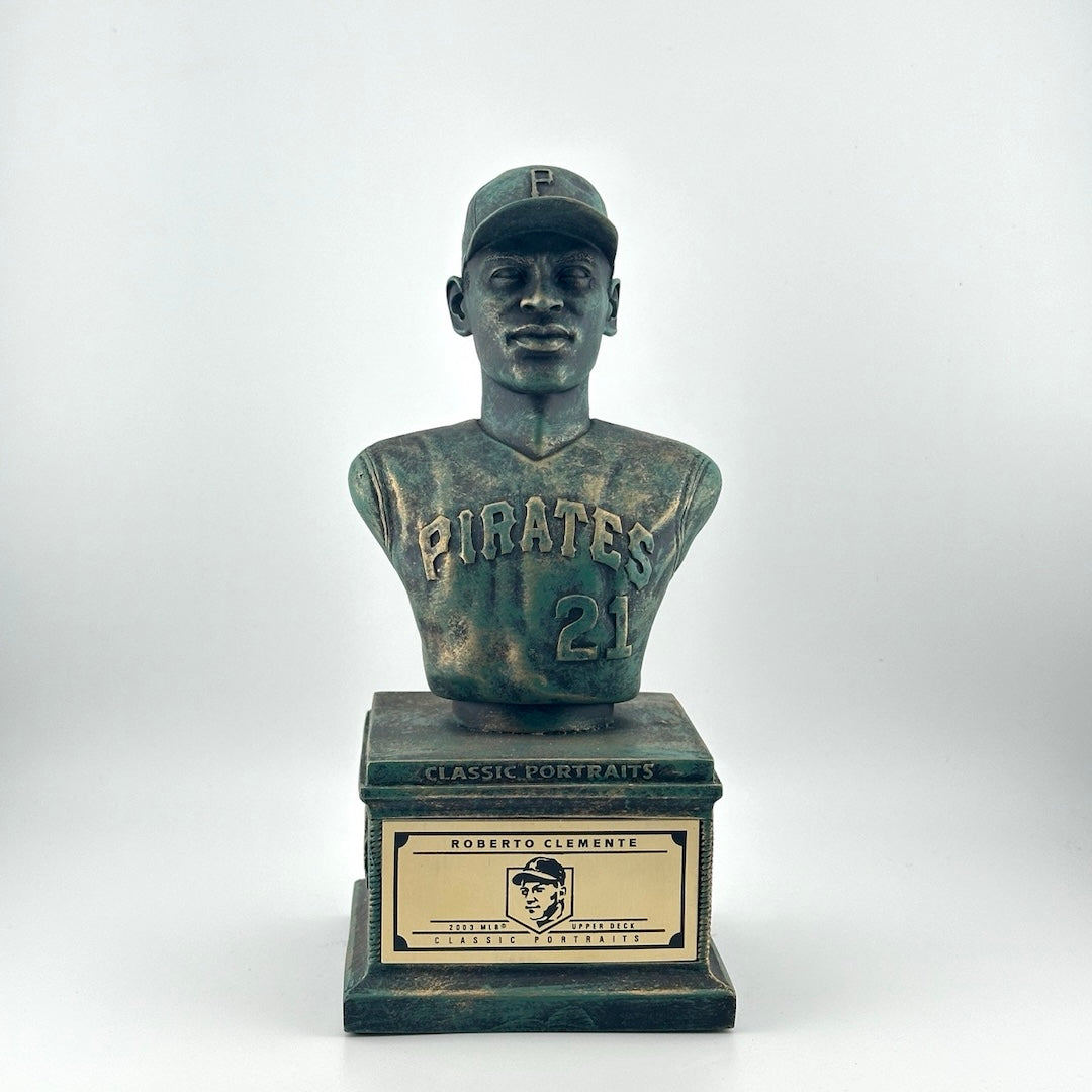Bronze pedestal with bronze bust of Clemente in Pirates uniform. Gold plaque on pedestal.
