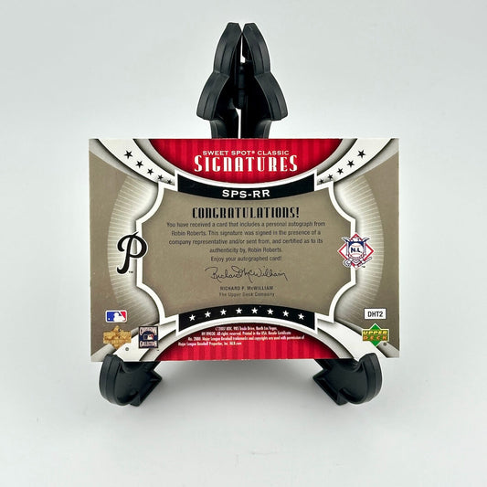 Card holder with a sports trading card featuring branding and text on a white background