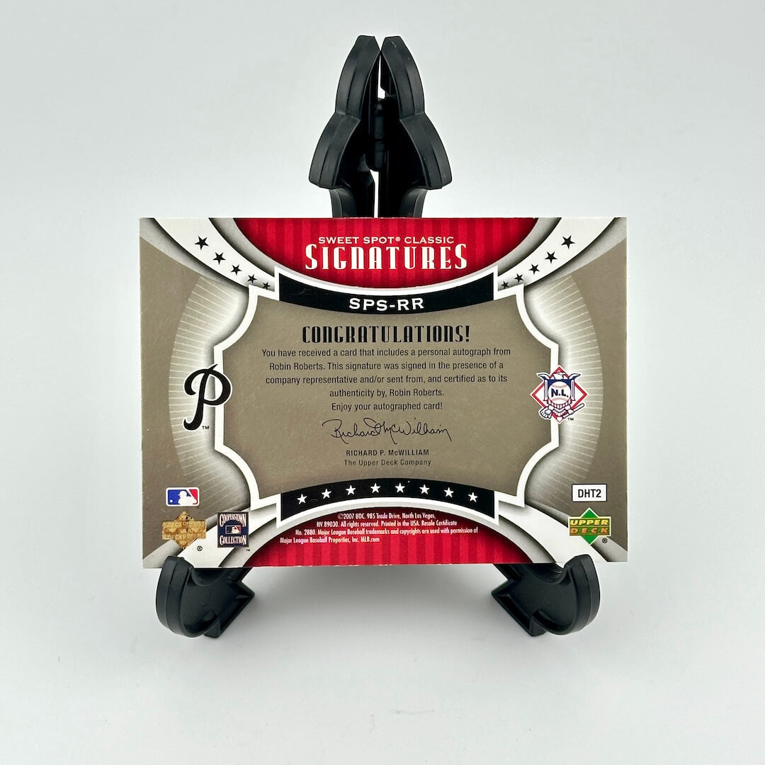 Card holder with a sports trading card featuring branding and text on a white background