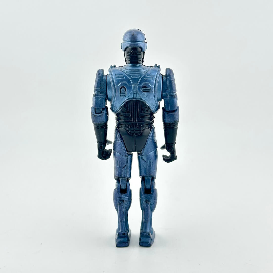 A blue and black action figure of a futuristic robot, shown from the back against a plain light gray background.