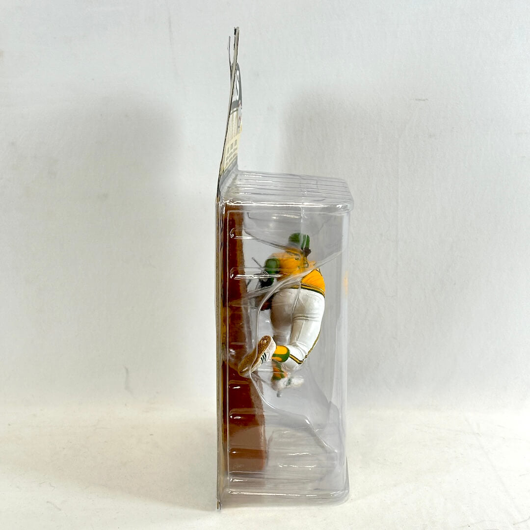Clear plastic packaging with a small figure inside on a white background