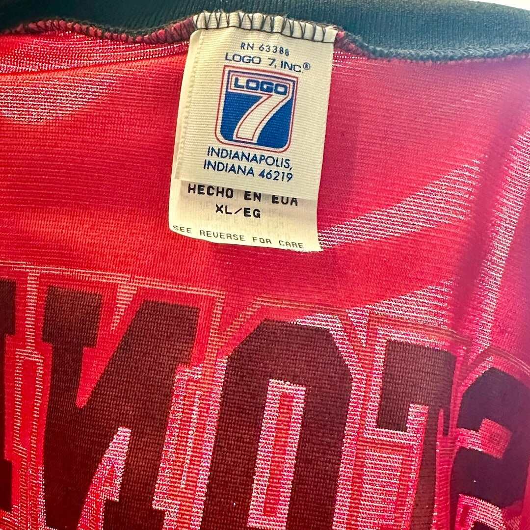 Close up of back neck tag with manufacturer & size information.