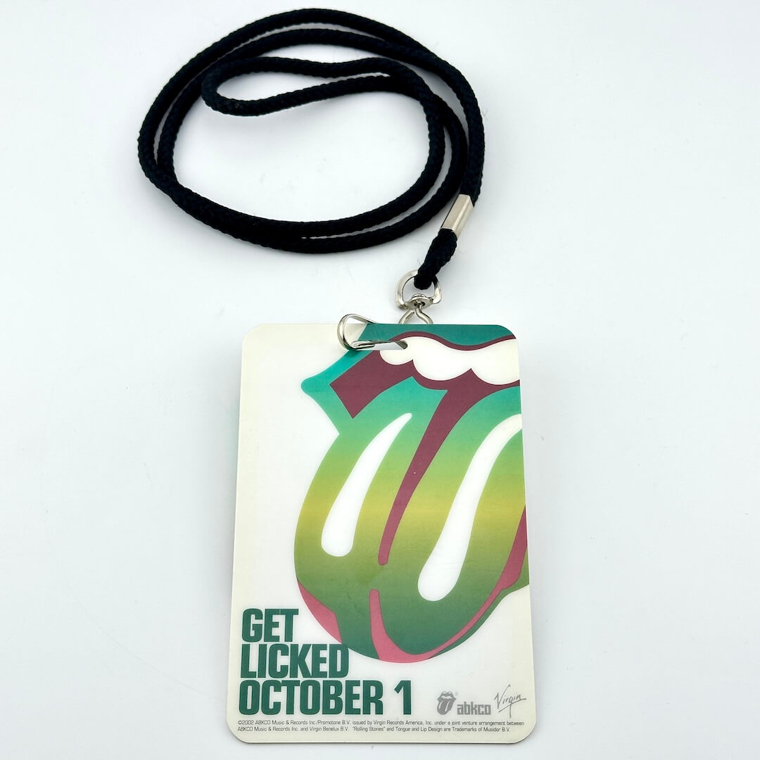 Lanyard with a Rolling Stones-themed badge on a white background