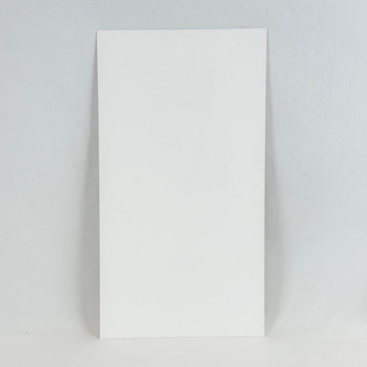 Backside of art print showing white rectangular paper photographed on white background.