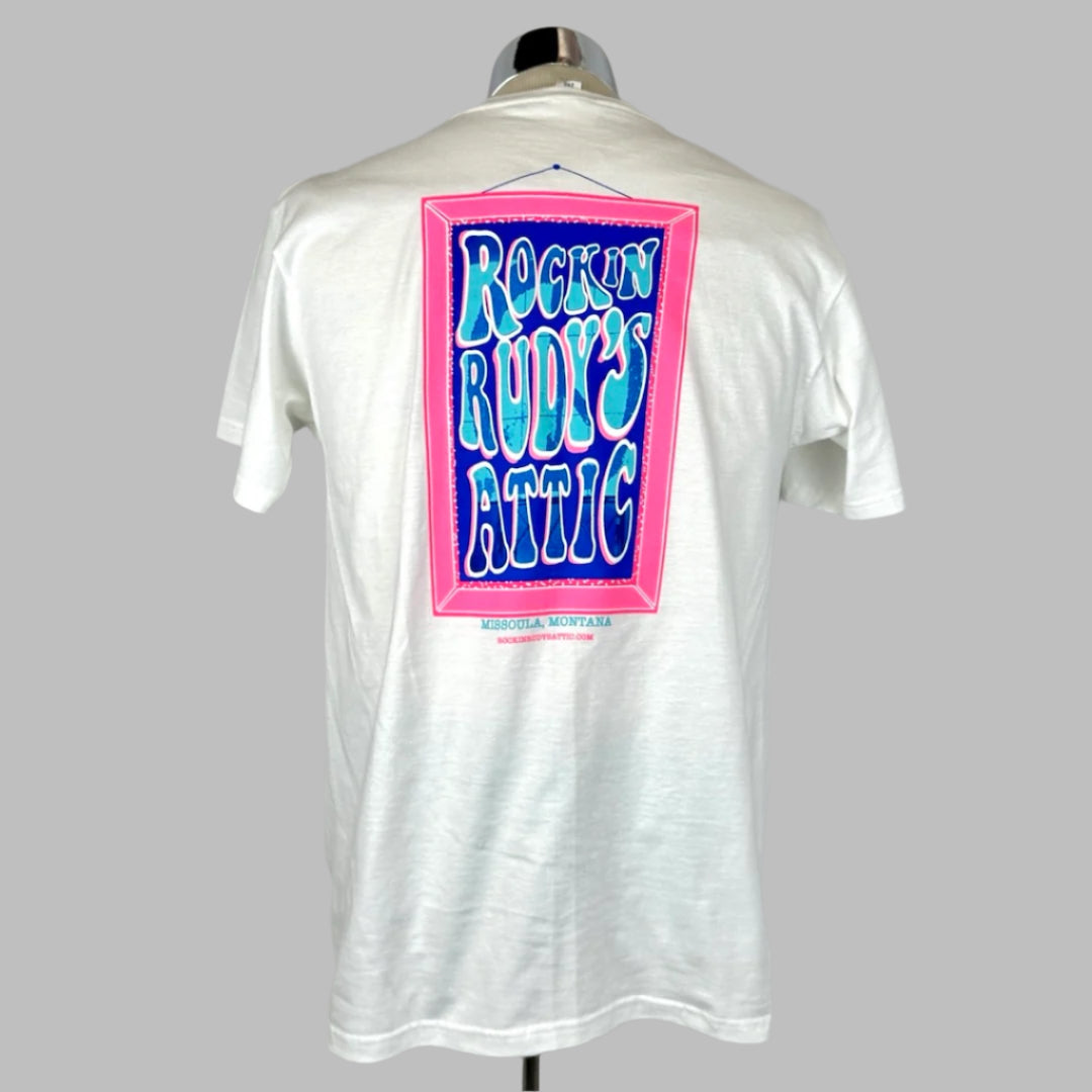 White short sleeve t-shirt with pink art frame with Rockin Rudy's Attic in center with Peace Sign sign in text.
