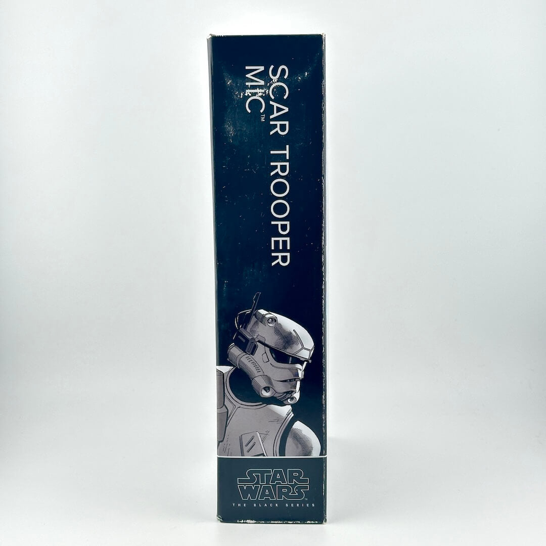 Side view of action figure package to show light wear around character's name and illustration.