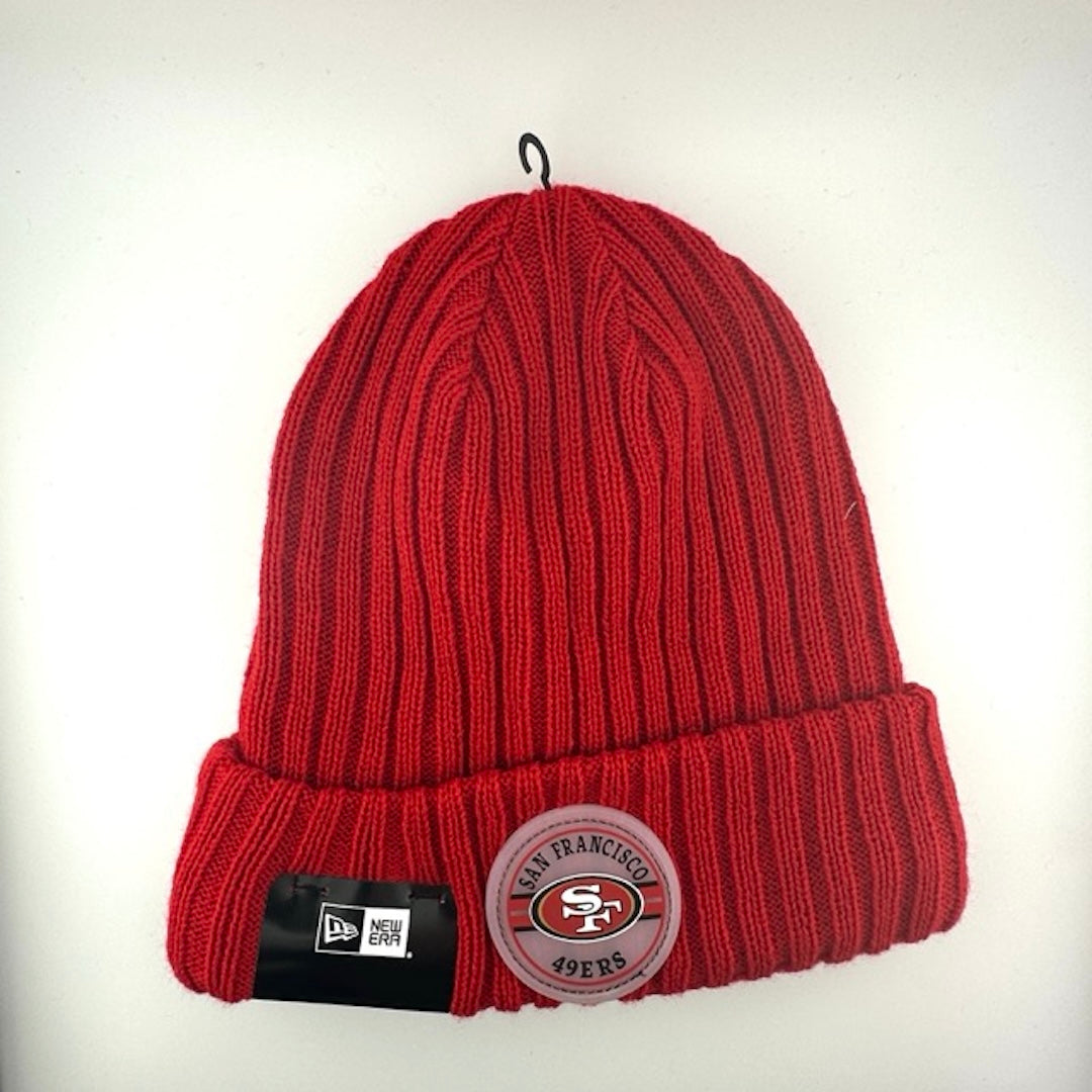 Red knit beanie with team crest logo patch front center. Red stitched new era logo off center.