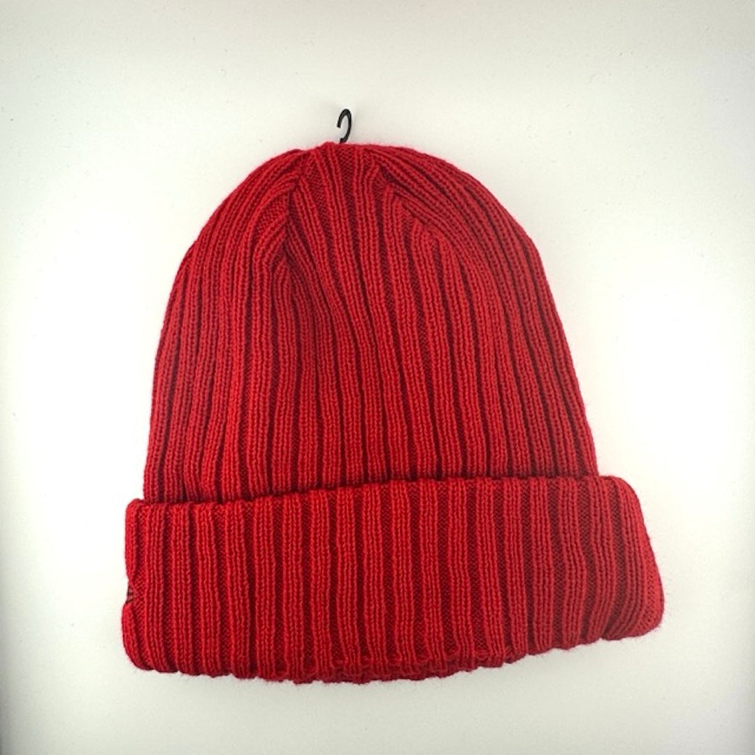 Red knit beanie with team crest logo patch front center. Red stitched new era logo off center.