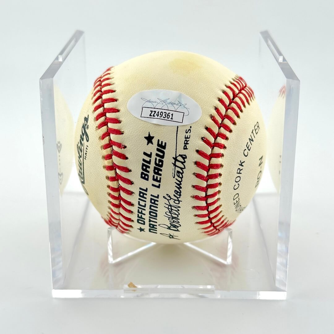 Signed baseball in clear display cube with Rawlings branding and JSA authentication sticker with number "ZZ49361"