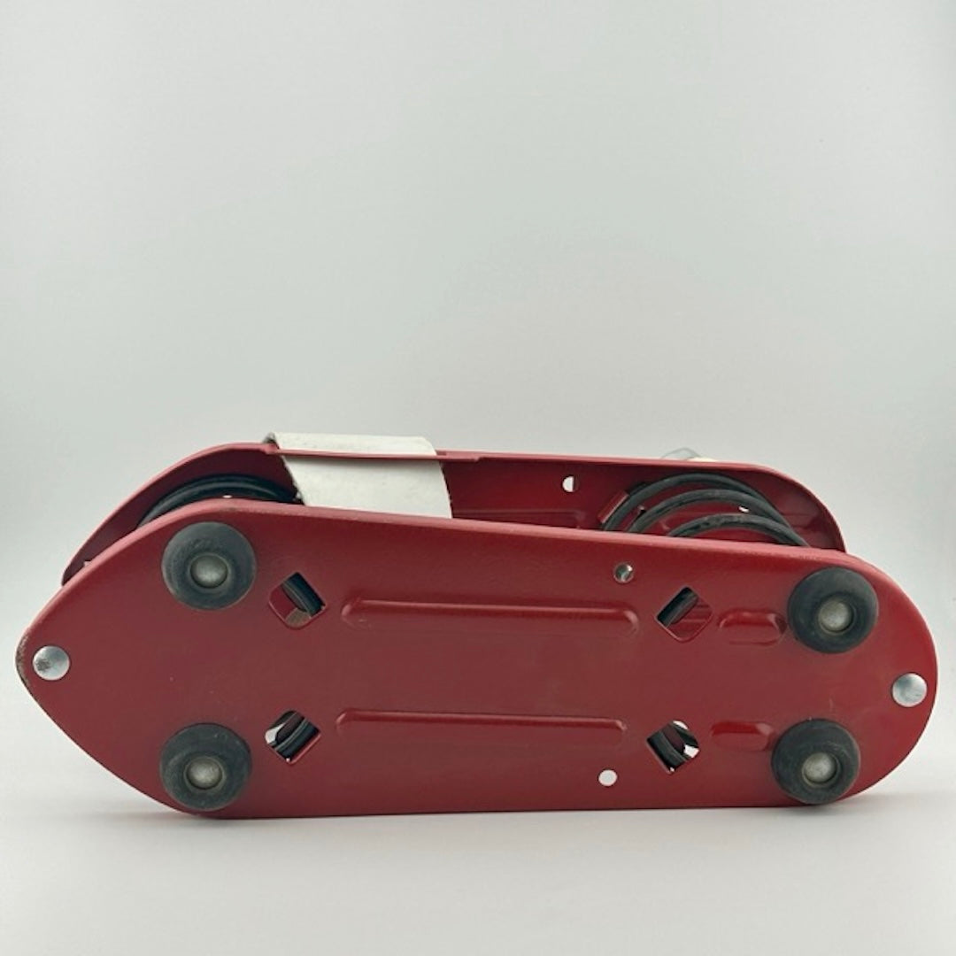 Bottom of red metal plate black rubber feet at four corners, no wear to bottom.