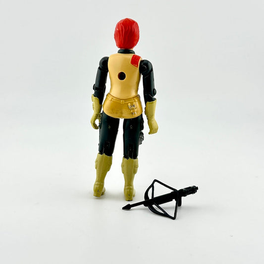 Toy figure with red hair and yellow outfit on a white background