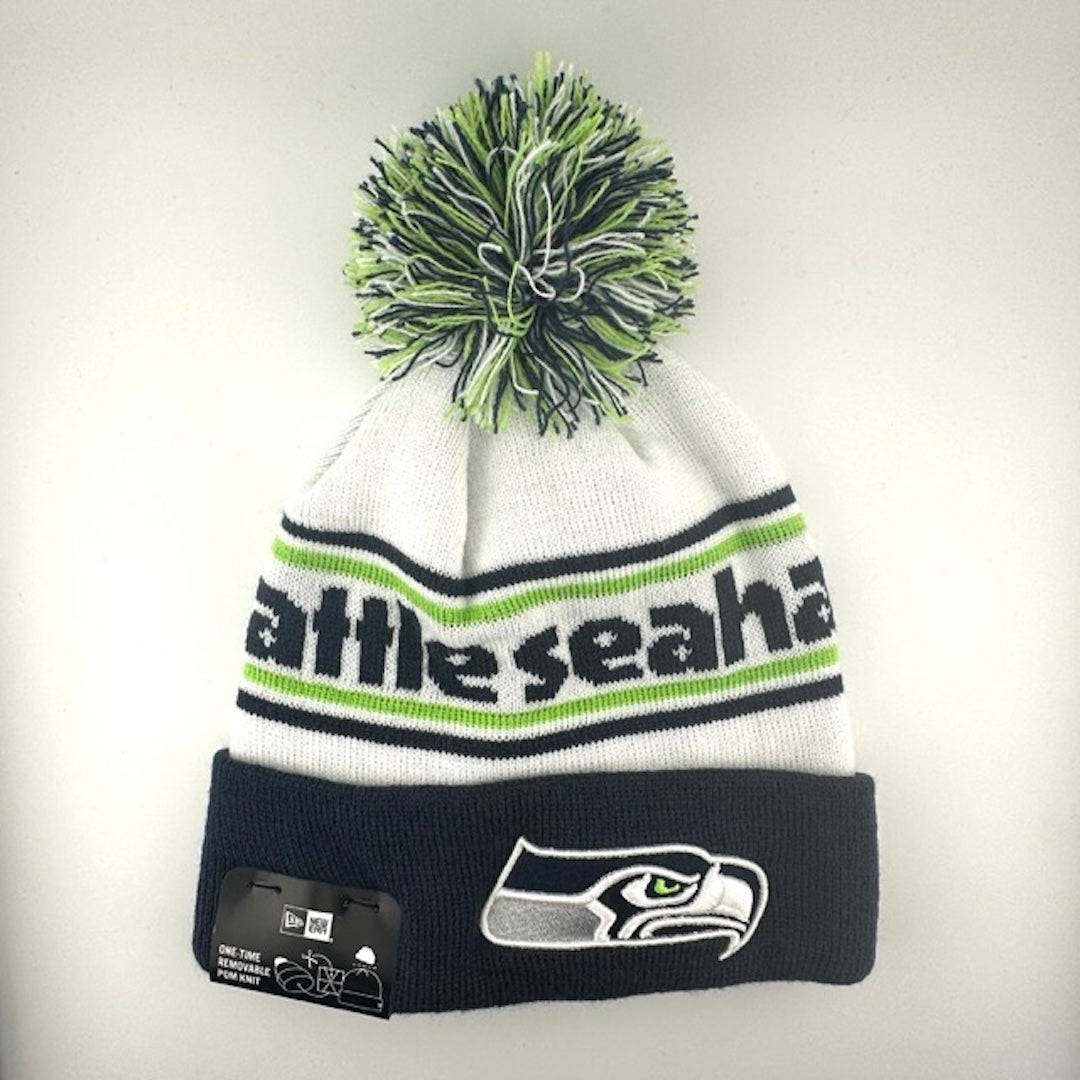 White knit cap with green/navy stripes around navy team name, Seahawks logo in center of navy cuff & green/navy/white pom