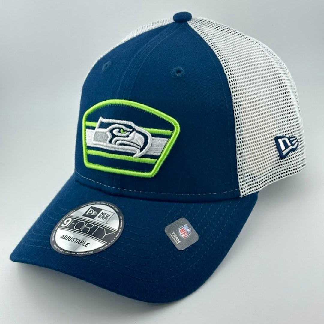 Baseball cap with white plastic mesh back, navy brim & face with Seahawks logo in center. New Era logo on left side.