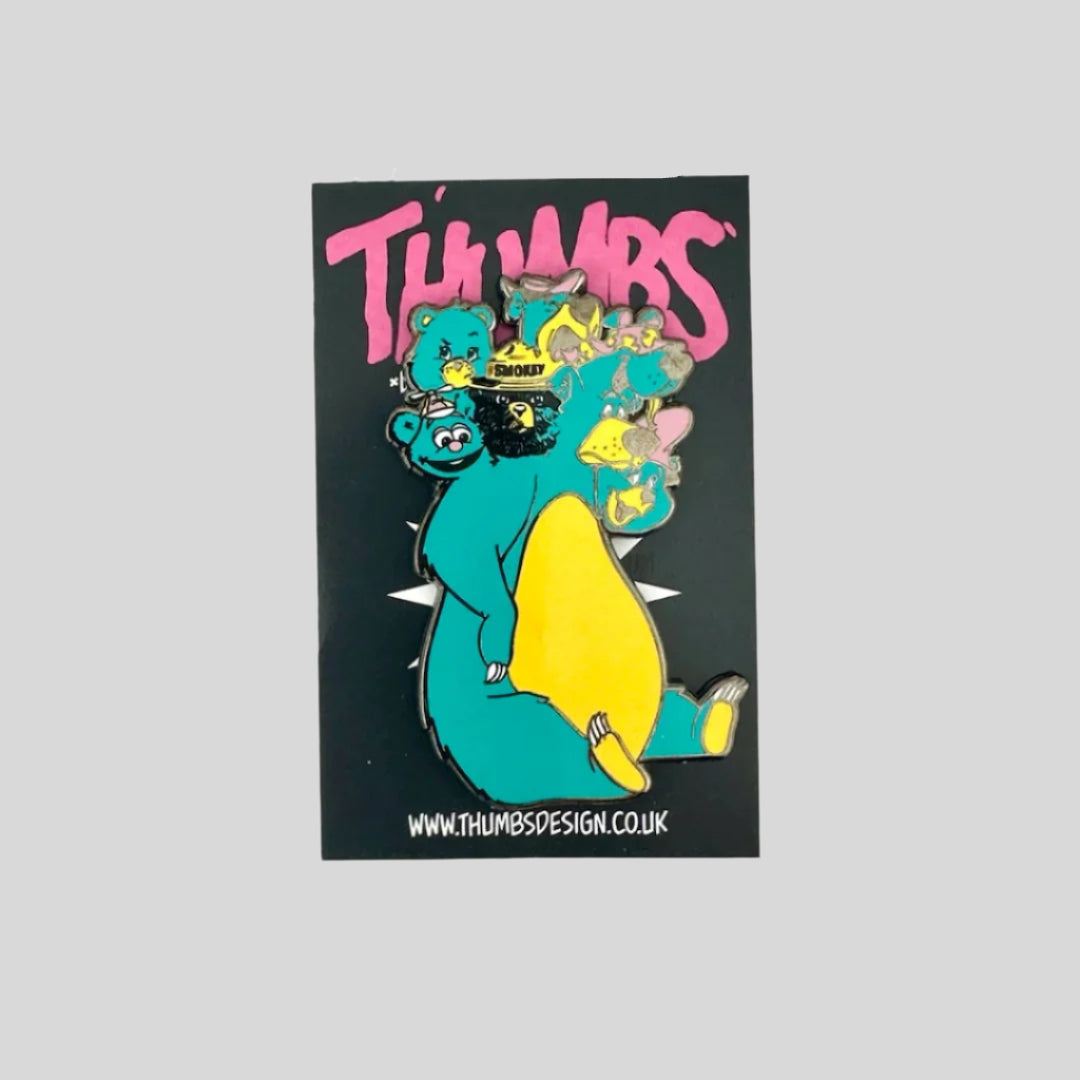 Blue bear pin with seven different bear character heads like Smokey, Tiny Toon Fozzie, a Care Bear, Yogi & Baloo.