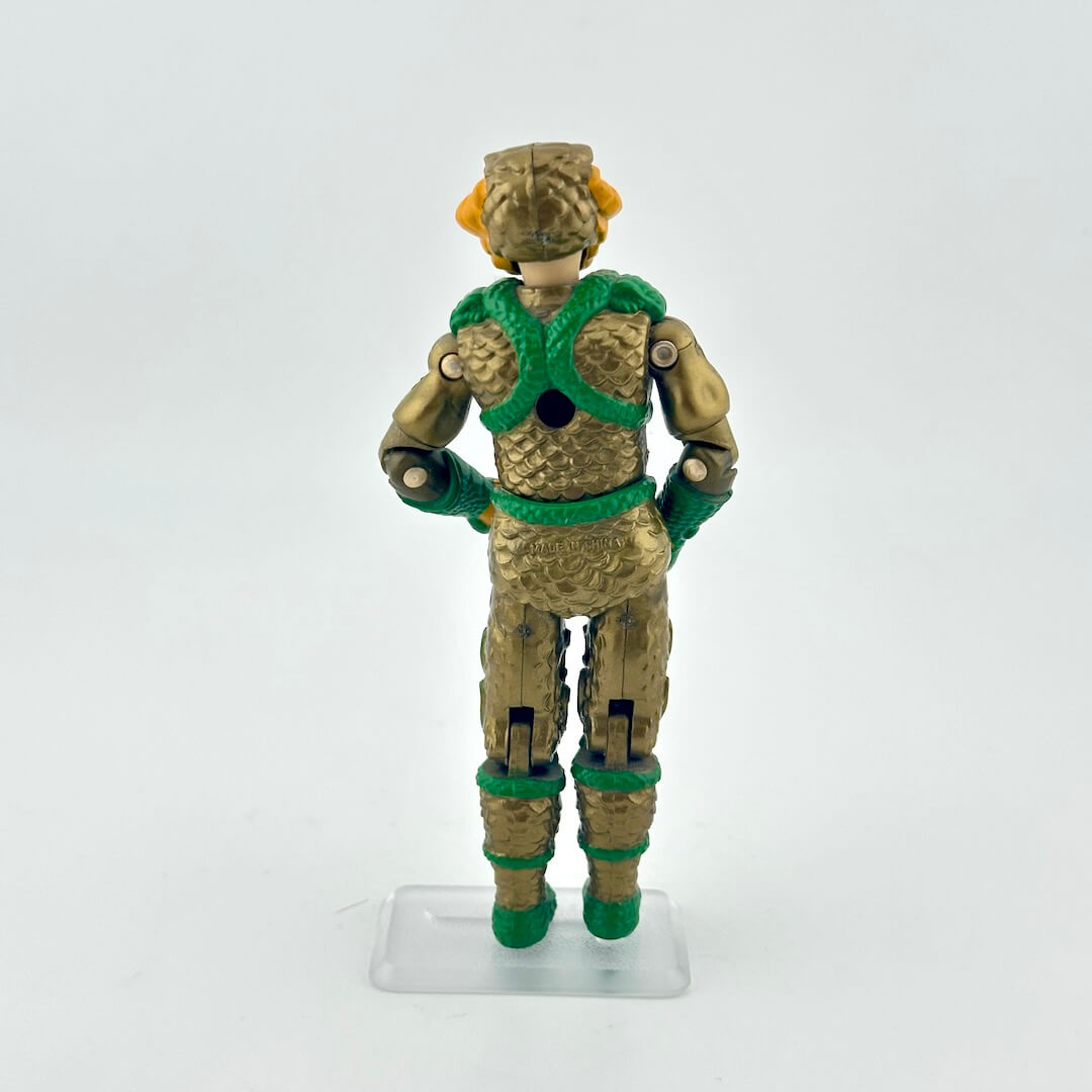 Toy figure with green and brown outfit on a white background