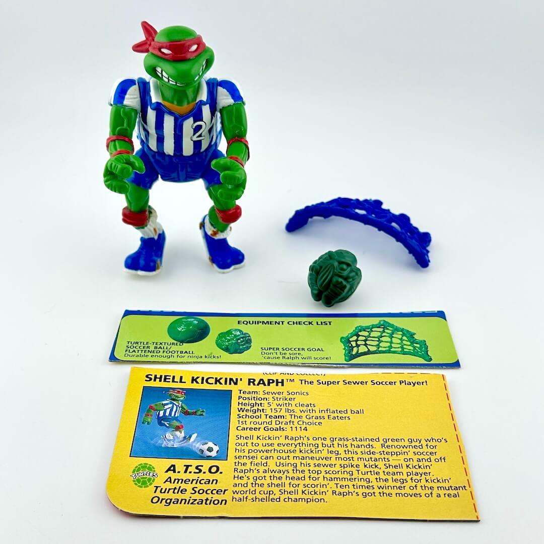 TMNT action figure with accessories and character card against white background.