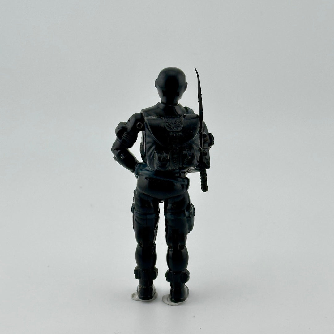 Black ninja action figure with black backpack, & black sword stored on backpack. Back view.