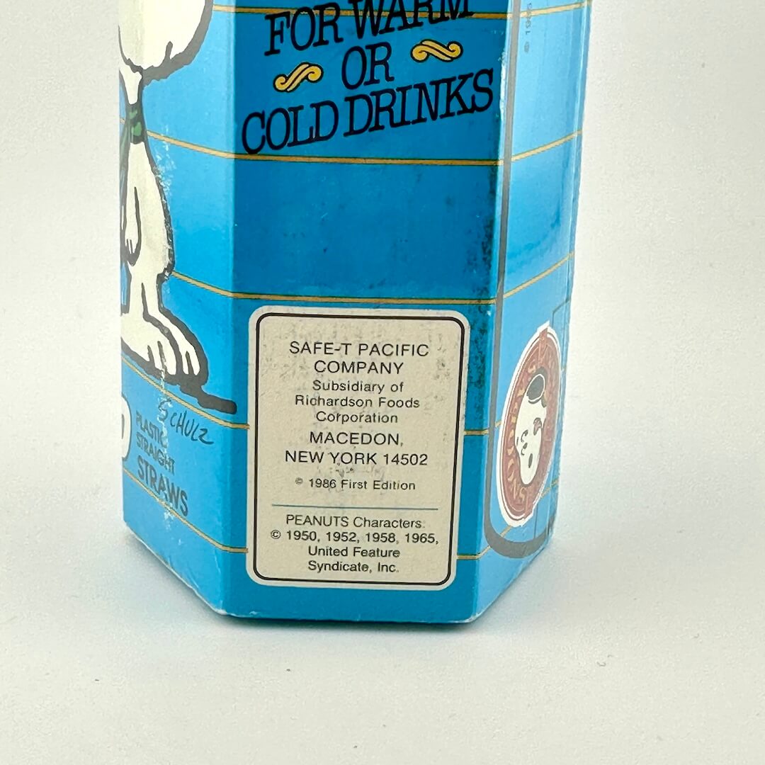 Close-up of maker's information sticker on side of packaging.