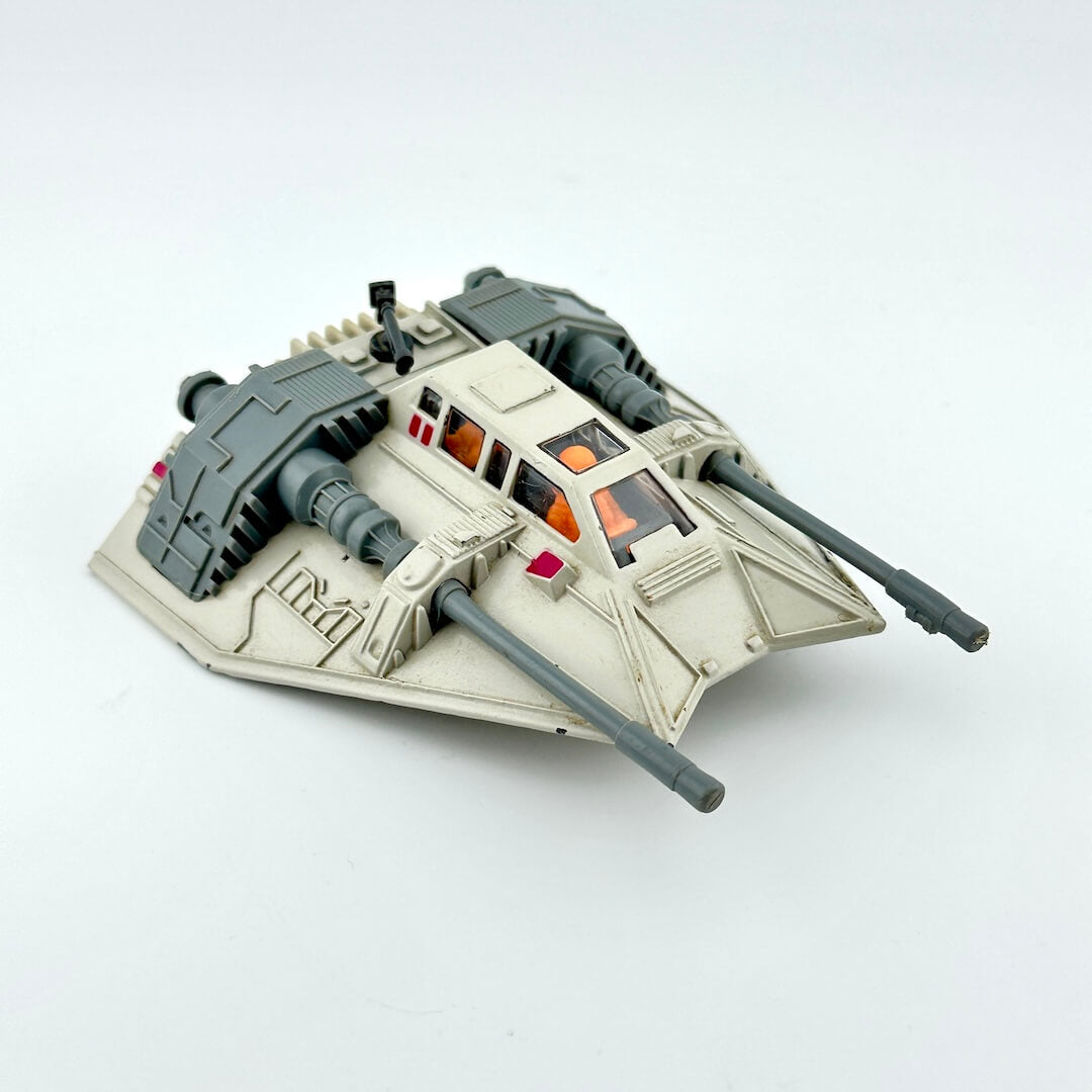 Diecast model of a Star Wars' Snowspeeder on a white background