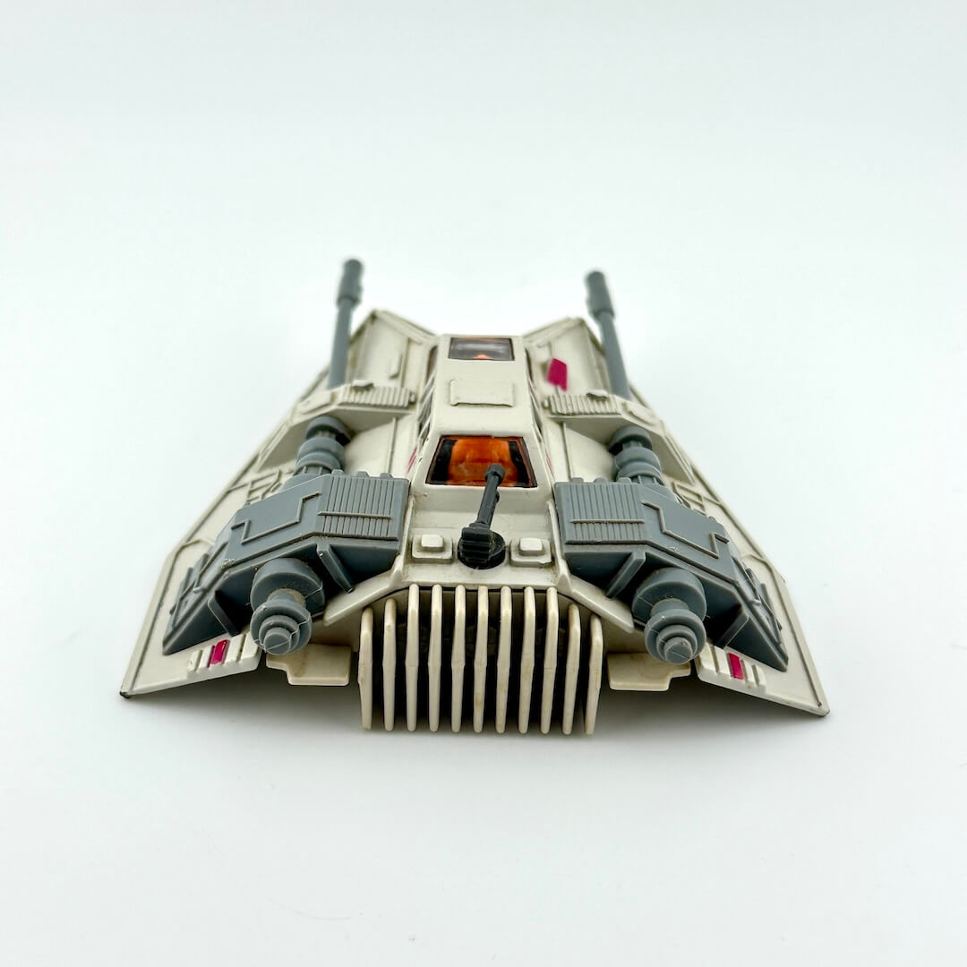 Diecast model of a Star Wars' Snowspeeder on a white background