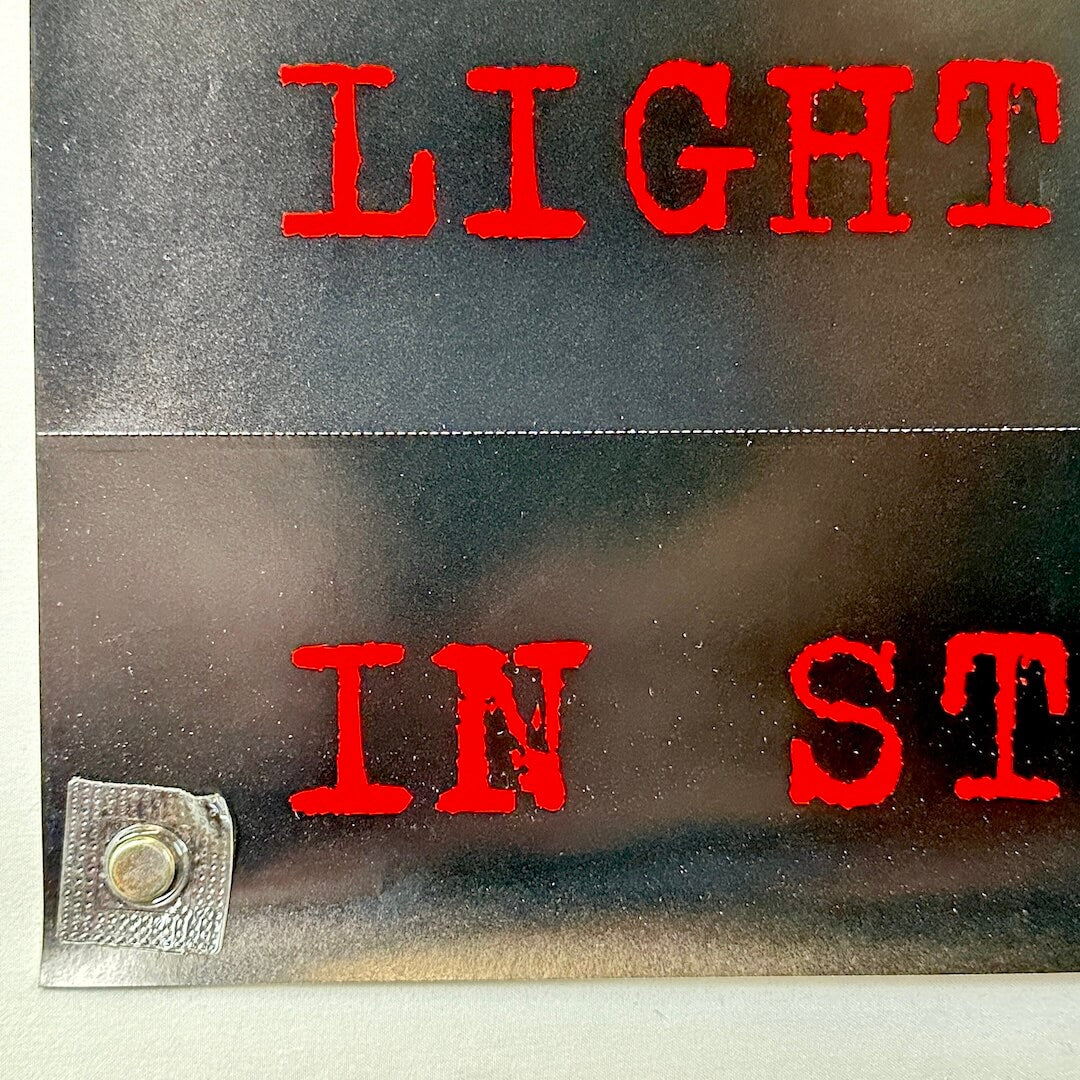 Bottom left corner of poster with no obvious damage.