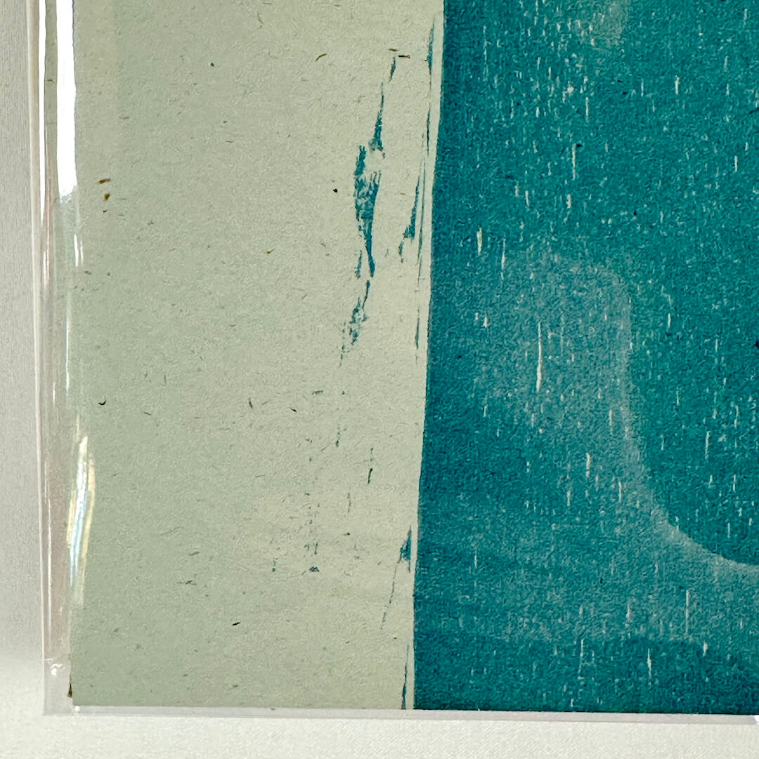 Bottom left corner of poster with crisp corner and clean edges.