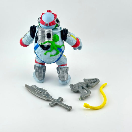 TMNT turtle action figure with accessories on white background.