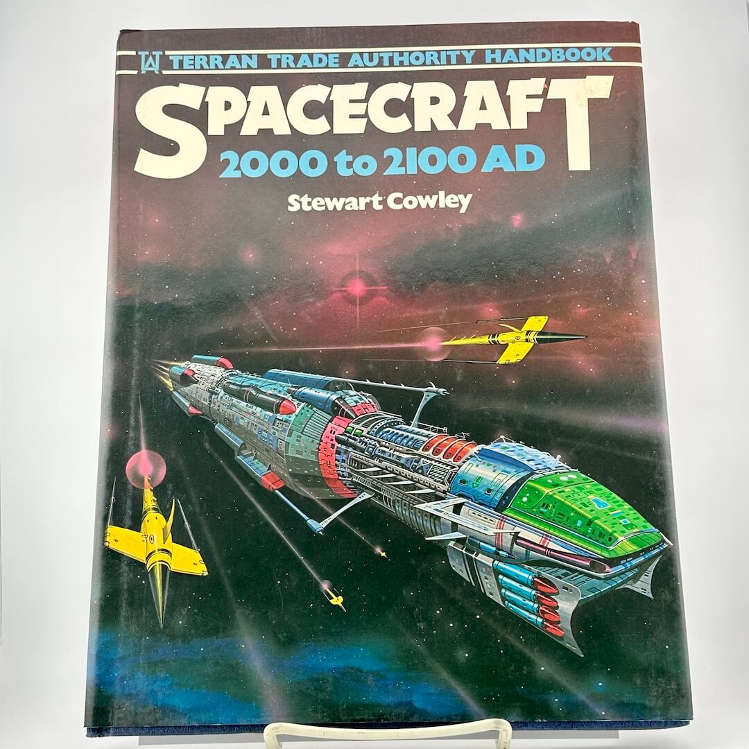 Book titled 'Spacecraft 2000 to 2100 AD' by Stewart Cowley on a white background