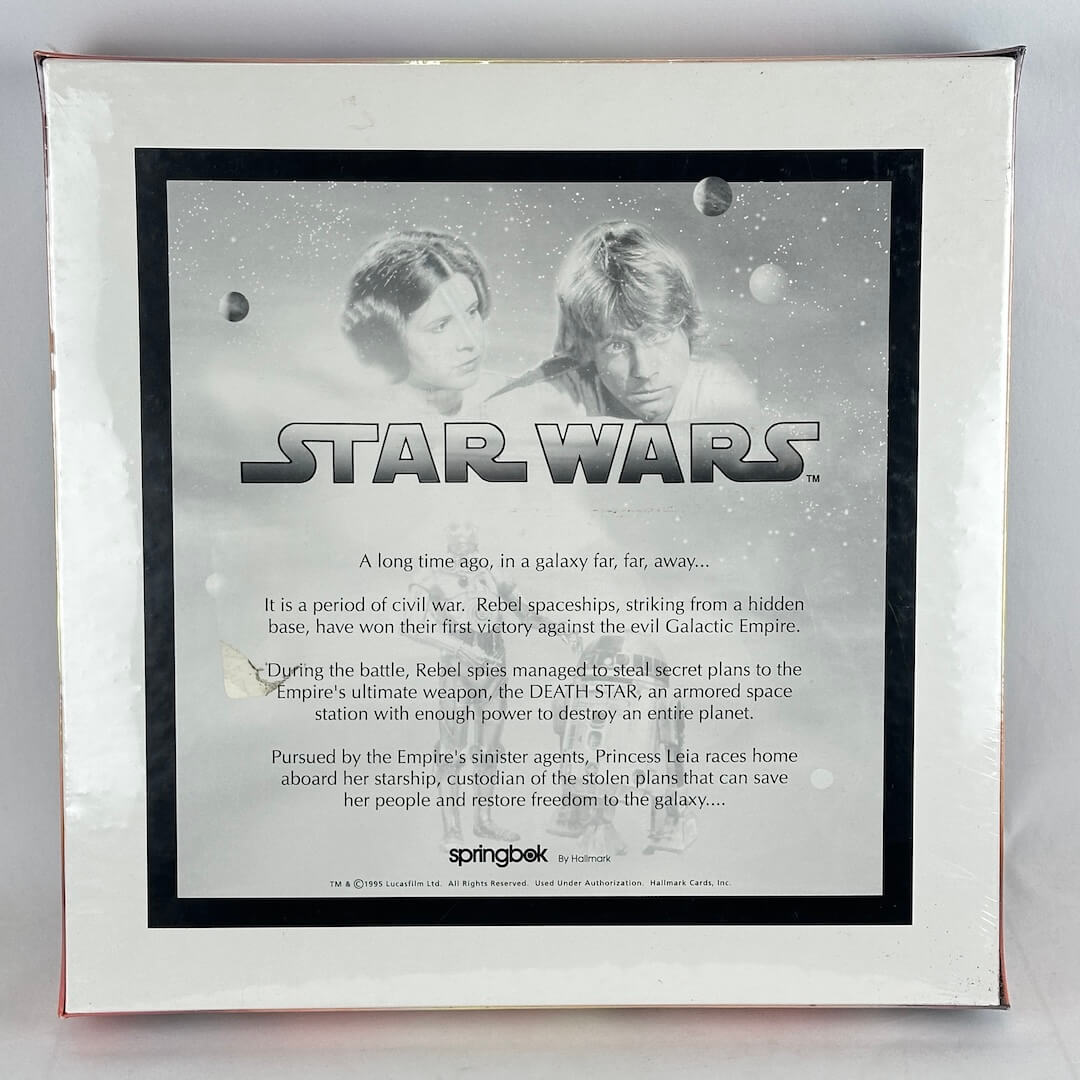 Star Wars packaging with characters and text on a gray background