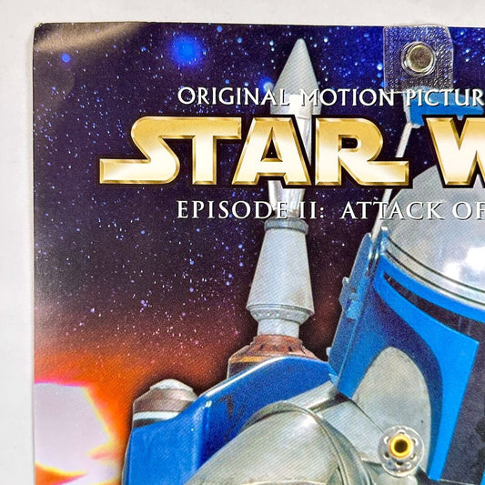 Star Wars movie poster for Episode II: Attack of the Clones with space-themed background
