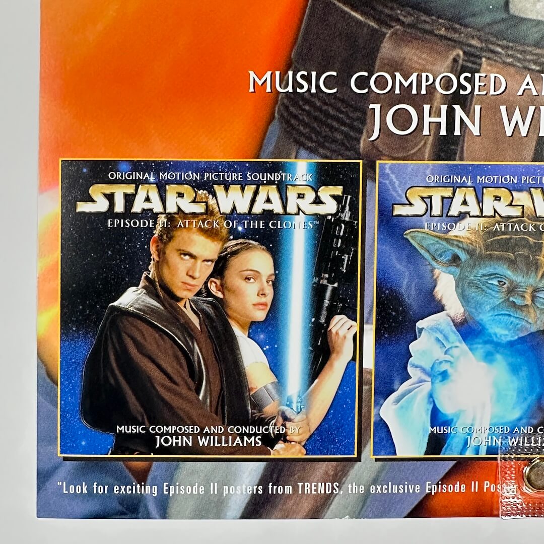 Two 'Star Wars' movie poster boxes with characters on a colorful background