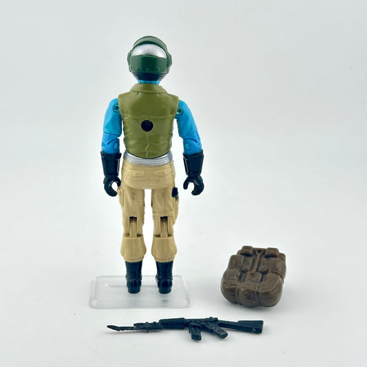 Toy figure in space suit with helmet and weapon on a white background