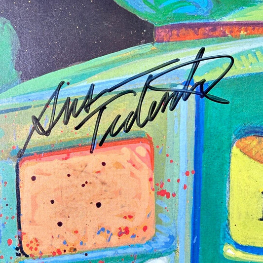 Colorful poster with a signature in the center