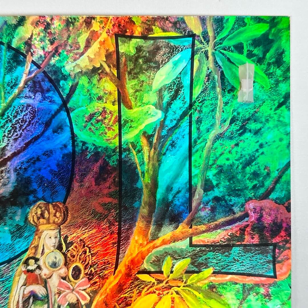 Top right corner with partial title on top of floral background, Victorian lady face at bottom, all on rainbow foil paper.