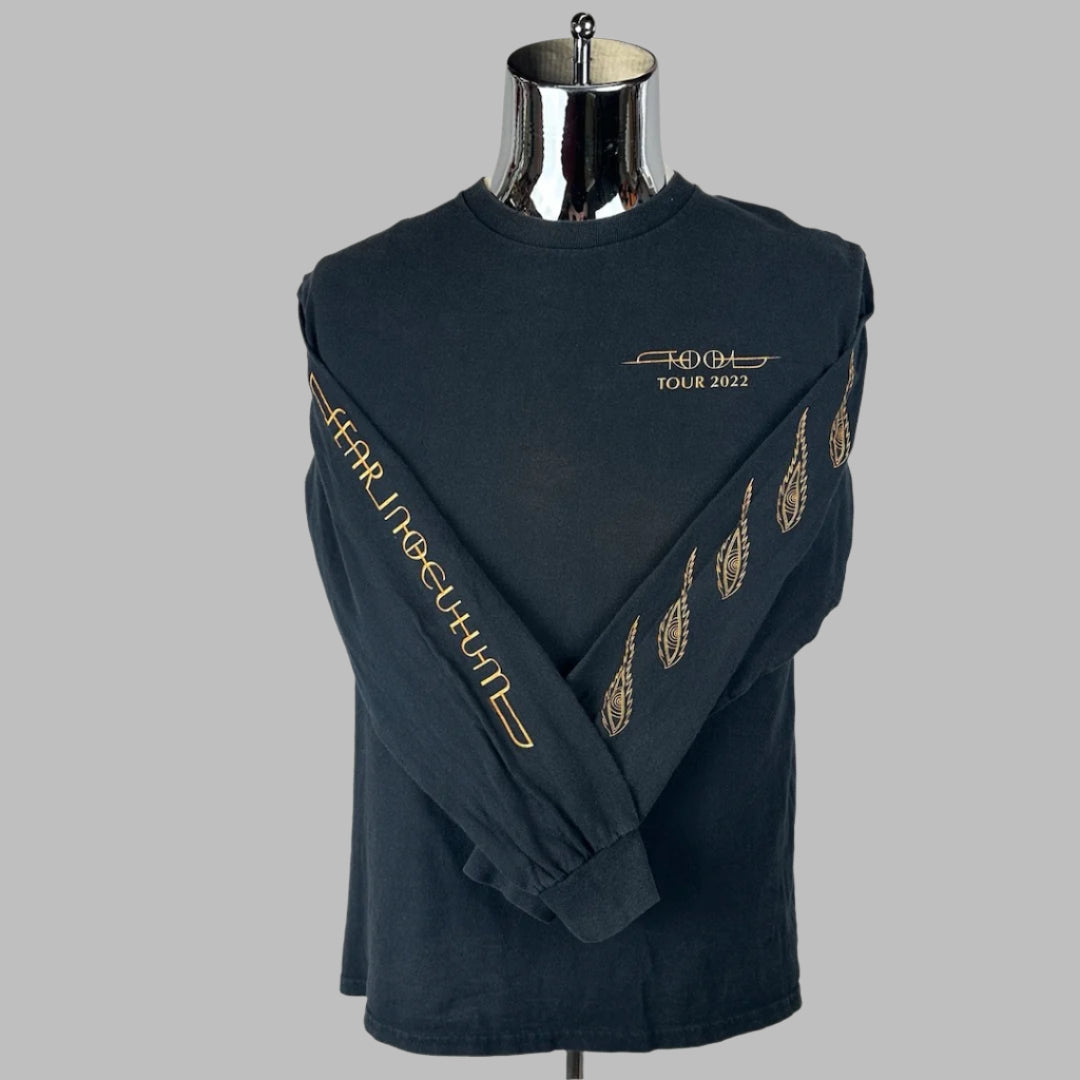 Black long sleeve shirt with band name on breast, tour name along one sleeve, and paisley design down other sleeve.