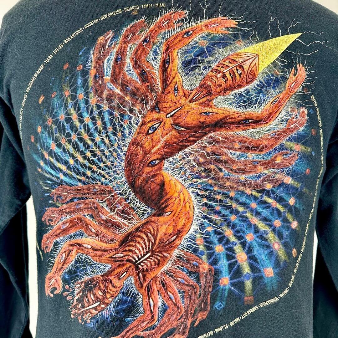 Close up of trippy double person graphic on back with exposed muscles with eyes covering bodies.