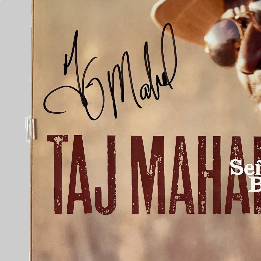 Close up of artist signature in black marker about printed artist name at mid left of poster.