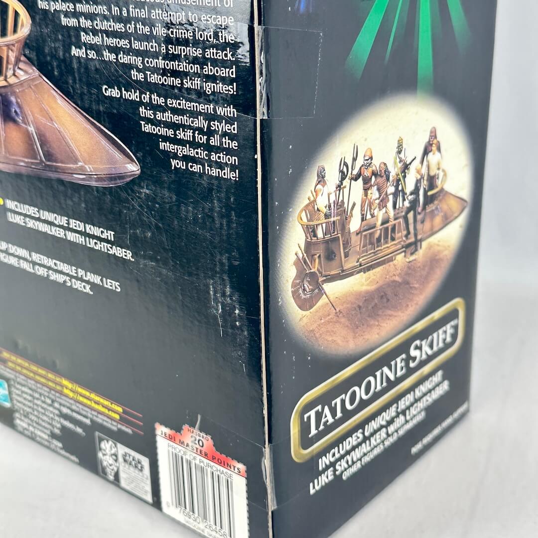 Close-up of tape seal on side of box showing that its intact and hasn't been opened.