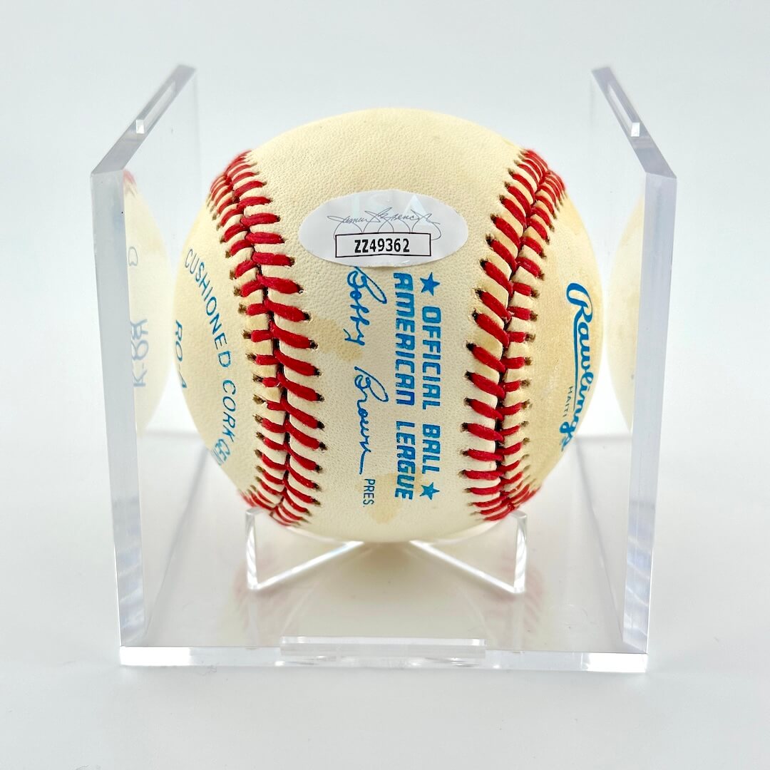 Signed baseball with Rawlings brandings and JSA sticker against white background.