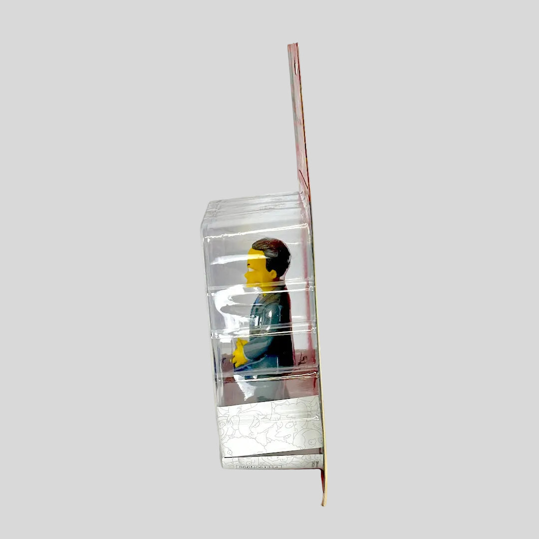 Small figurine inside a clear plastic box with a white background